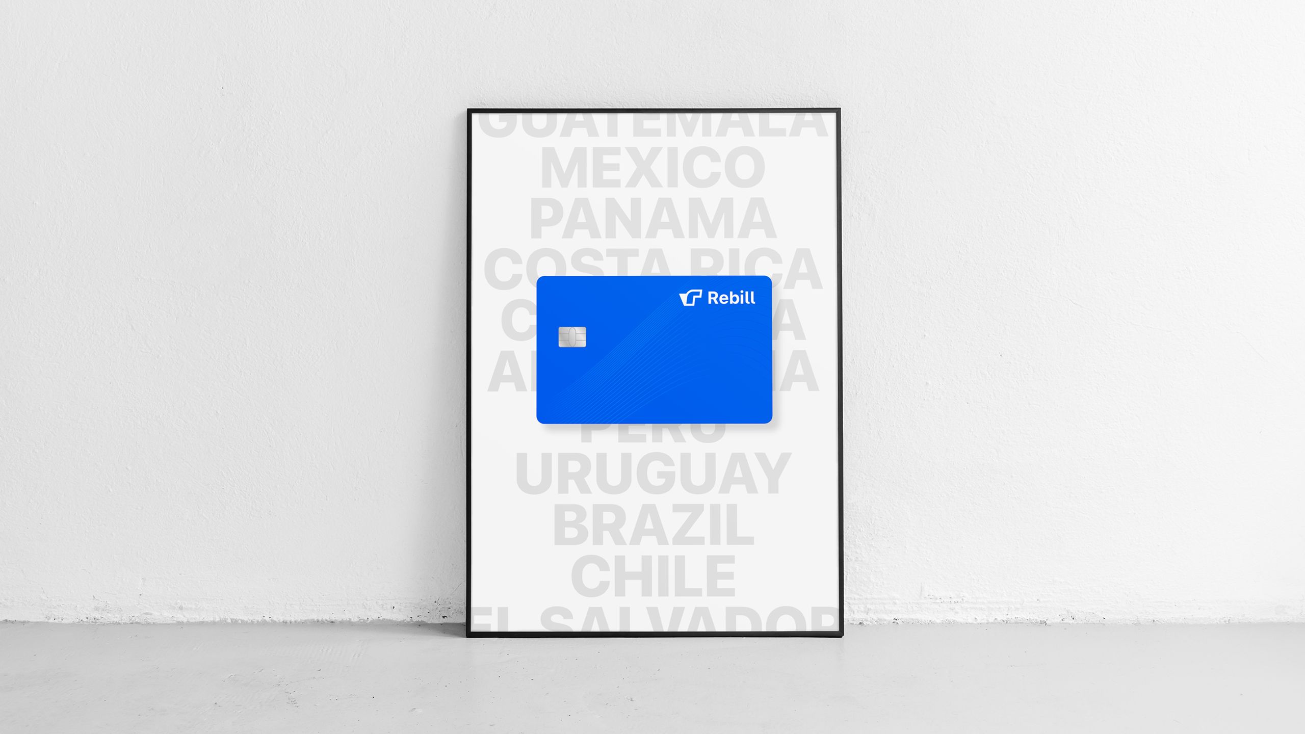 Framed poster with a bright blue Rebill payment card overlaid on the names of Latin American countries, highlighting Kundo Studio’s visual identity for Rebill as a scalable, Stripe-grade payments and subscriptions platform across LATAM.